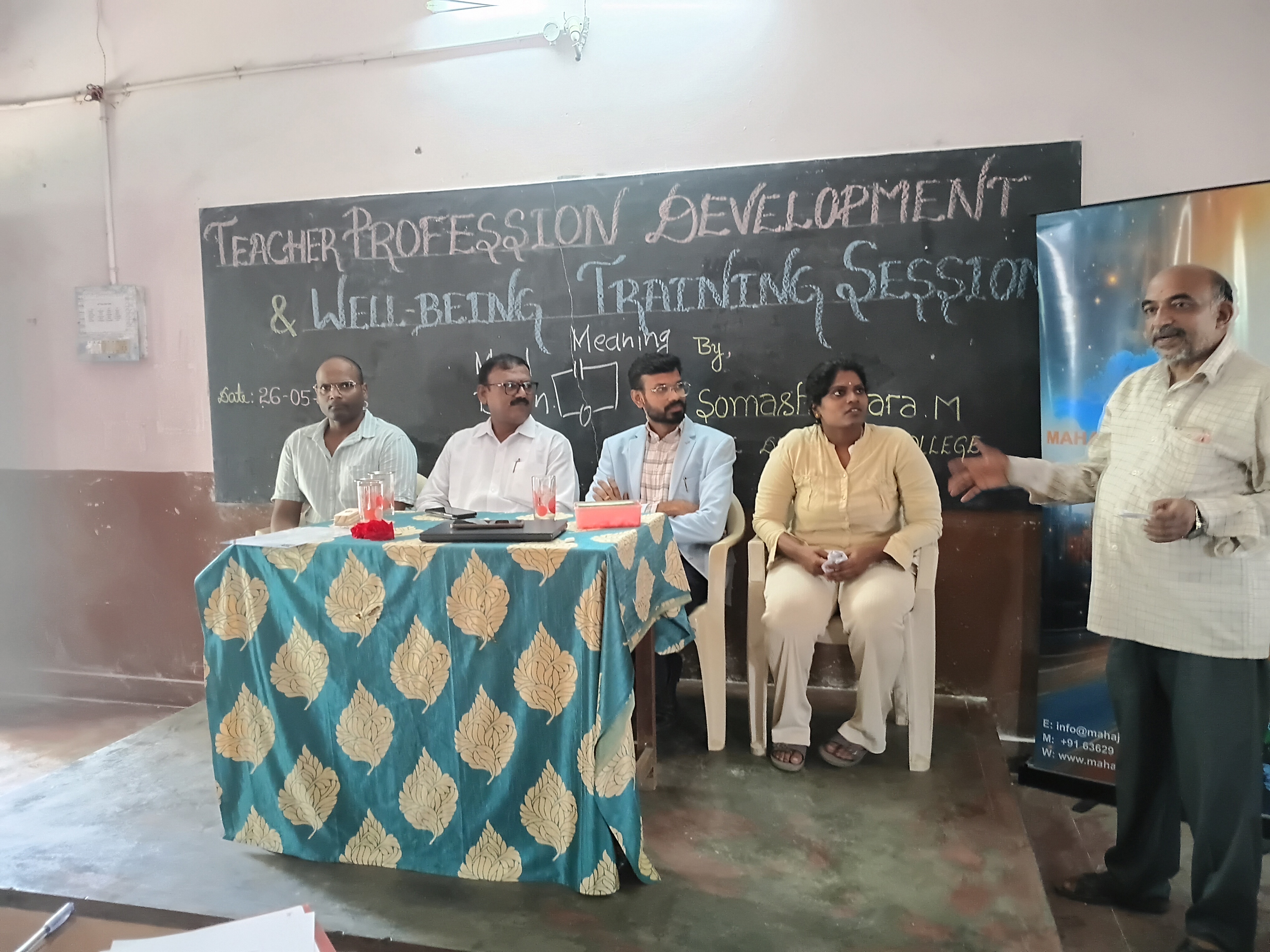 Dignitaries on the dais during the closing speech, Paper Town English School, May 2026